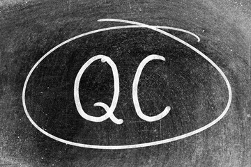 Sticker - White chalk hand writing in word QC (Abbreviation of Quality Control) and circle shape on blackboard background