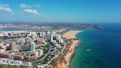 Canvas Print - Tourist Portuguese city of Portimao aerial view on a sunny day. South Portugal Algarve. view of river arade.