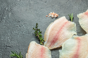 Raw tilapia fish fillet meat. ready to cook. superfood concept. Healthy, clean eating. place for text, top view