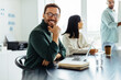 © (JLco) Julia Amaral - Business man sitting in a boardroom during a meeting