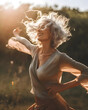 A beautiful middle aged woman dancing in the sunshine in the nature - Generative AI