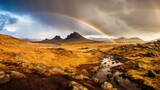 Fototapeta Tęcza - Delight in the magical sight of a stunning rainbow adorning the sky, gracefully spanning the horizon above a breathtaking mountain landscape. Generated by AI.