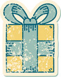 iconic distressed sticker tattoo style image of a present