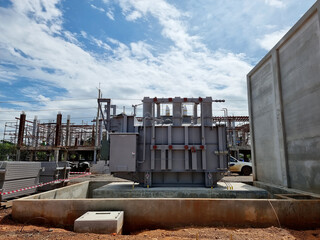 Wall Mural - Construction of Substation, Main tank power transformer Installation with fire barrier and control building construction background