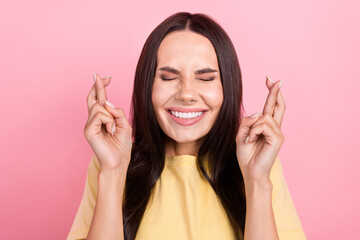 Sticker - Photo of funky nervous woman dressed yellow t-shirt crossed fingers closed eyes isolated pink color background