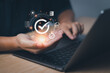 © PB Studio Photo - Businessman hand showing checked icon, concept Quality Assurance(QA) and Quality Control (QC) certification standards in a product or service guarantee