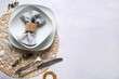 © Pixel-Shot - Wicker mat with stylish table setting and candle on grunge white background