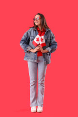 Poster - Young woman with flags of Canada on red background