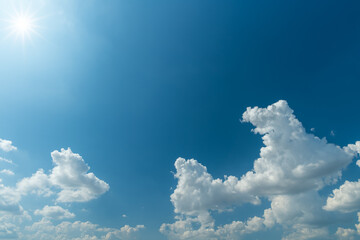 Canvas Print - white clouds and sun with sunlight on blue sky.
