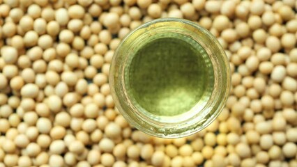 Sticker - close up of Raw soy bean seed oil in a container 