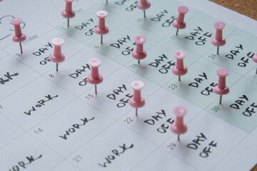 4 day work week printed calendar with pink pins on three days off in week weekend days four day working week concept. Modern approach doing business short workweek. Effectiveness of employees