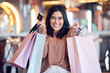 © Julia van der Westhuysen/peopleimages.com - Portrait, excited and woman with a credit card, shopping and bags with transactions, fashion and boutique clothes. Face, female person and customer with fashion, deal or retail with products or items