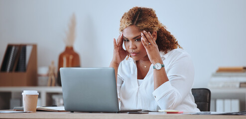 Wall Mural - Stress, angry and woman with a startup fail, headache and sad in a company office desk working on a laptop. Frustrated, burnout and young entrepreneur thinking of a risk or problem, tired and mistake