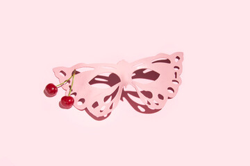 Women carnival masquerade Venetian mask, aesthetic romantic costume party layout, pastel pink background.  