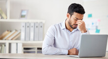 Mental Health, Man With A Headache And Burnout With Laptop At His Desk At A Modern Workplace Office. Stress Or Tired, Mistake Or Fatigue Problem And Male Person Sad Or Depressed At His Workstation