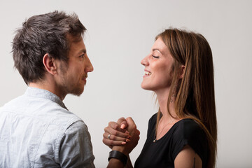 Playful defiance in arm wrestling challenge