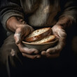 The poor man's hands are holding pieces of bread. Hunger and poverty concept. generative AI