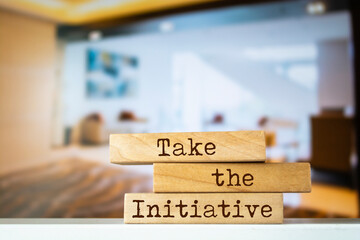 Wall Mural - Wooden blocks with words 'Take the Initiative'.
