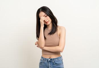 Wall Mural - Upset confused bad emotional asian woman. Unhappy stressed female. Young lady standing feeling depressed dramatic scene on isolated background.