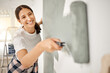 © Clayton Daniels/peopleimages.com - Woman, renovation and painting a home wall in DIY, house project or maintenance or construction, interior design and decoration. Paint, bedroom or remodel space with paintbrush, roller and painter