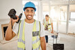 © Clayton Daniels/peopleimages.com - Portrait of man, construction and home renovation with drill, helmet and working mindset in apartment. Yes, smile and diy renovations, happy handyman in safety and building project tools in new house