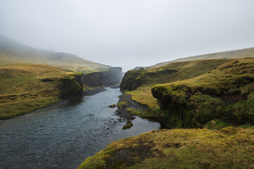 Wall Mural - Fjadrargljufur canyon on south iceland in rainy weather - moody vibes