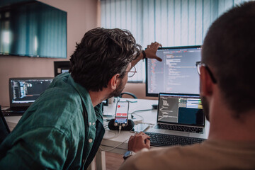 programmers engrossed in deep collaboration, diligently working together to solve complex problems a