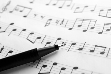 Canvas Print - Sheet with musical notes and pen, closeup