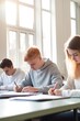 © Future Vision - Caucasian schoolboy with diverse children in classroom, created using generative ai technology