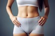 © nadunprabodana - Woman showing her slim waist. Beautiful slim woman body. Generative AI