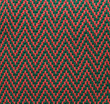 Knitted Texture With Chevron Pattern. Texture Of Mosaic Fabric With Pink Green Geometric Ethnic Pattern. Crochet Mosaic Pattern.