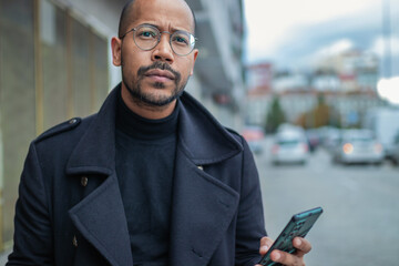 Wall Mural - latino man with mobile phone