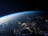 Fototapeta Kosmos - Earth - Europe  at Night. Planet Earth from the space at night. Europe at night viewed from space with city lights in Germany, France, Spain, Italy, UK. Elements of this image furnished by NASA.