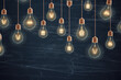 Chalkboard background with light bulbs, symbolizing the power of great ideas Generative AI