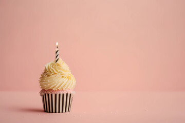 Wall Mural - Birthday cupcake with a candle on a light pink background, generative AI