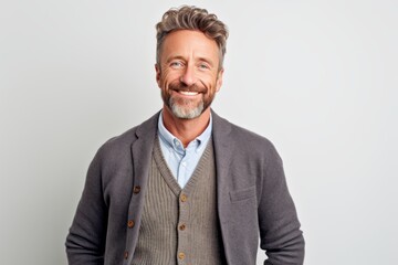 Portrait of a handsome mature man smiling at camera isolated on a white background