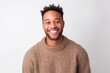© Robert MEYNER - Portrait of a happy young african american man smiling against white background