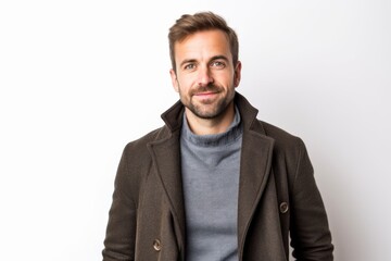 Medium shot portrait photography of a satisfied man in his 30s that is wearing a chic cardigan against a white background . Generative AI