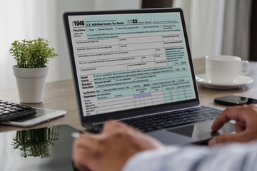 Wall Mural - Financial time tax form with laptop Accounting documents, office paperwork, refunds, and investment taxation report analysis and calculation online