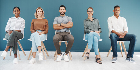 Canvas Print - Group, business people and chair portrait by wall with smile, diversity and waiting room for hr recruitment. Men, women and smile together for interview, human resources and hiring for job at startup