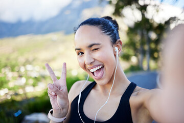 Happy woman, fitness and selfie with peace sign for profile picture in social media or online post in nature. Portrait of funny female person or runner with fun expression for photo or vlog outdoors