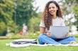 © Sanele G/peopleimages.com - Study, laptop and portrait of woman in park for education, relax and college research. Elearning, university and scholarship with student on grass lawn for technology, school report and online exam