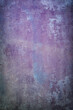 Closeup of old concrete wall in purple and blue