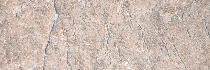 Wall Mural - Rock texture. Snow and cracks on the surface of the cliff. Natural stone background.