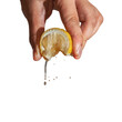 Hand squeeze lemon with lemon juice drop