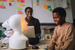 © Maskot - Happy student communicating with illuminated social robot at innovation lab