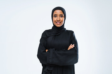 Beautiful arab middle-eastern woman with traditional abaya in studio