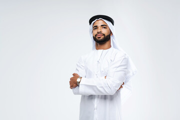 Handsome arab middle-eastern man with traditional kandora portrait in studio