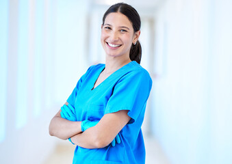 Wall Mural - Woman, nurse smile and portrait with arms crossed and job in a hospital and clinic. Employee, healthcare and wellness professional with happiness and confidence from doctor and medical work and care