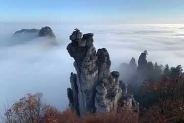 Poster - natural rock formation surrounded by haze or mist, with a view of the sky, created with generative ai